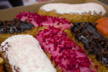 French pastry glazed Eclairs with cream and chocolate. Variety Selection