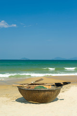 Naklejka na ściany i meble Traditional fishing boat on the beach of Hoi An