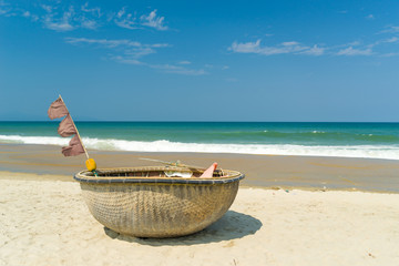 Traditional fishing boat on the beach of Hoi An