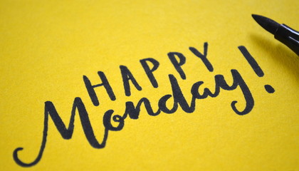 HAPPY MONDAY hand-lettered on a yellow background
