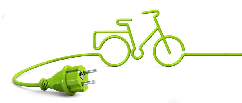 Green power plug lying on the floor and bent in a bicycle shape