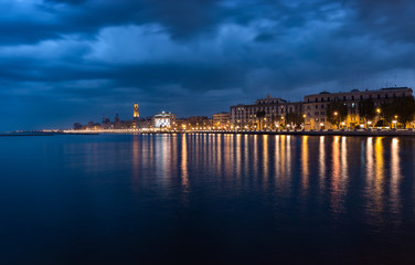 Bari italy night cityscape coastline from sea. Citylights at seafront after sunset