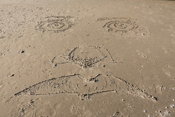 Face Carved in Sand