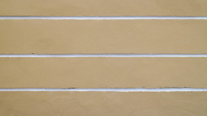 Yellow wall with white horizontal stripes