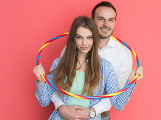 portrait of happy couple with hula hoop