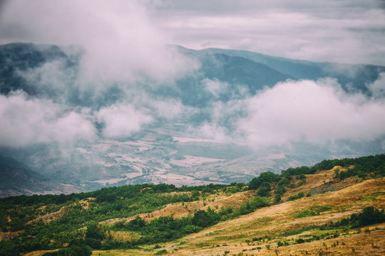 View of mountains Babadag in the clouds and a river Girdimanchay Lahij yolu from the side in Lahic village, Azerbaijan