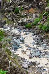 View of mountains Babadag and a muddy river Girdimanchay Lahij yolu from the side in Lahic village, Azerbaijan