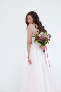Beautiful Bride Woman Fashion Model with Colorful Flower Arrangement