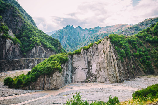 View of mountains Babadag and a muddy river Girdimanchay Lahij yolu from the side in Lahic village, Azerbaijan