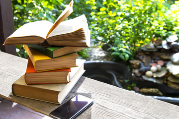 Naklejka premium books in garden