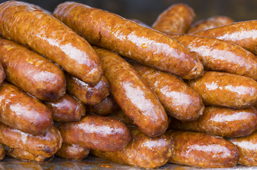 Fried delicious pork sausage shot close-up