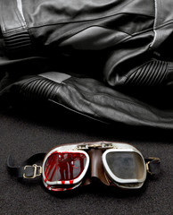old Motorcycle glasses with blood and jacket behind