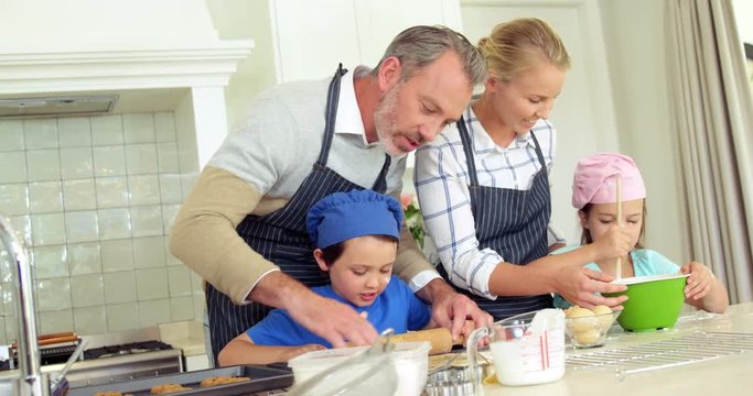 Family preparing dessert in kitchen