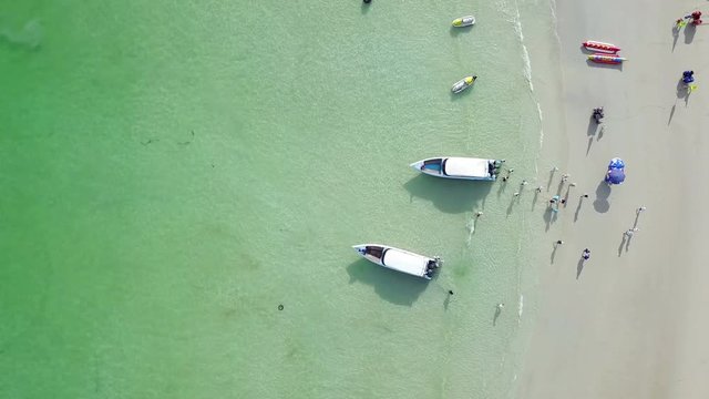 4K Aerial view of a speedboat transit passenger to the beach