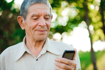 Grandfather with mobile phone in hand