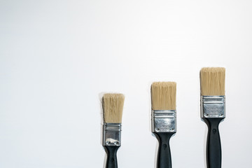 Black paint brushes isolated on white
