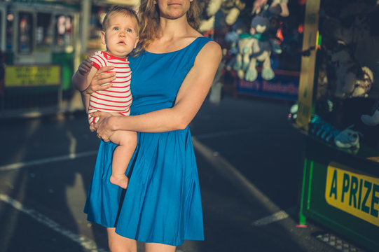 Mother with baby at the funfair