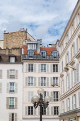     Paris, attractive facades in Saint-Germain-des-Pres, with geometry of the windows, charming typical building 
