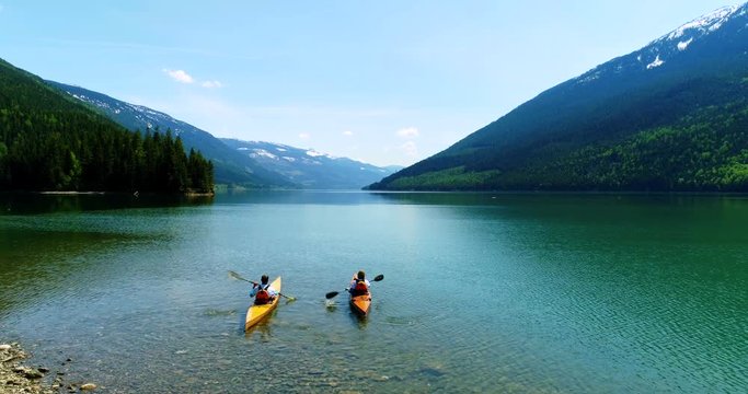 People kayaking in lake 