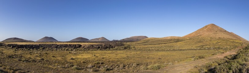 Fototapeta na wymiar volcanos in Timanfaya national park near Mancha Blanca