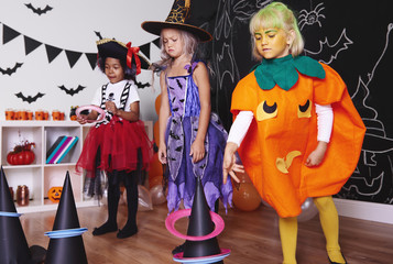 Children actively spending time at Halloween party