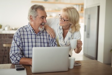 Fototapeta premium Senior couple using laptop