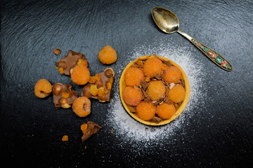 raspberry cake tart with cream, almond and chocolate