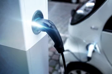 Zelfklevend Fotobehang Snelle auto electrical car charging on a charging pillar