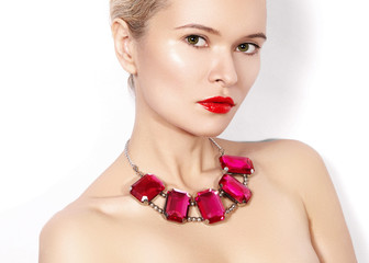 Fashion woman with luxury jewelry. Beautiful girl with bright necklace. Fashionable jewellery and accessories