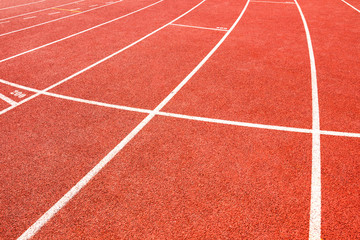 red running track on athletic stadium
