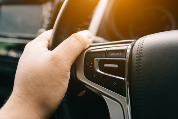 Obraz premium audio control on car steering wheel