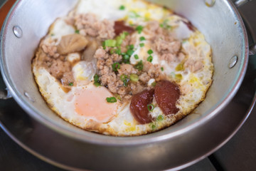 Pan fried egg with pork and toppings