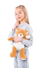 smiling child with teddy bear