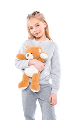 smiling child with teddy bear