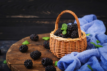 Fototapeta na wymiar Summer berry on table. Healthy lifestyle concept, blackberries in basket