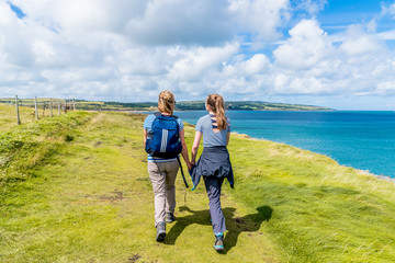 Mother and Daughter walking on coast path
