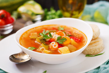 Minestrone - "big soup", soup with many ingredients - a dish of Italian cuisine, light seasonal vegetable soup with pasta.