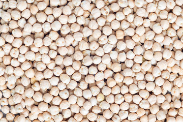 Food background with uncooked dry chickpeas, top view