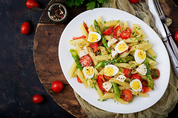 Salad - penne pasta with asparagus, tomatoes, quail eggs, mozzarella
