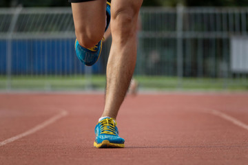 Close up runner legs on the track race