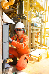 Technician,Instrument technician on the job calibrate or function check pneumatic control valve in...