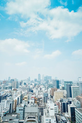 Fototapeta na wymiar Business concept - panoramic modern city skyline bird eye aerial view with spiral tower and midland square under dramatic cloud and morning bright blue sky on Nagoya TV Tower in Nagoya, Japan