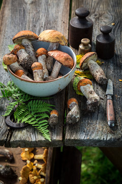 Fresh wild mushrooms on old wooden rustic table