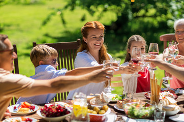 happy family having dinner or summer garden party
