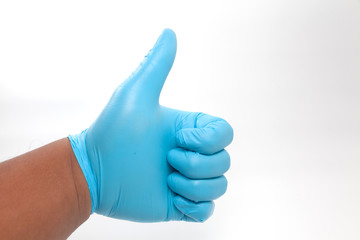 hand in blue glove Giving Thumbs Up Sign