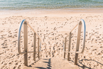 Fototapeta premium Stairs to an empty beach in Cote d'Azur, France