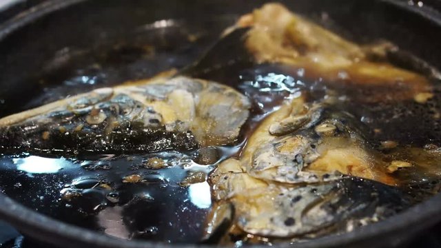Japanese style Salmon head boiling in sauce rich with protein and Omega