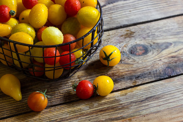 Colorful tomatoes in the basket
