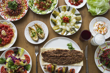 Kebab; healthy and fresh salad varieties and appetizer on wooden table
