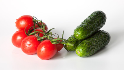 cherry tomatoes and cucumber on a white background